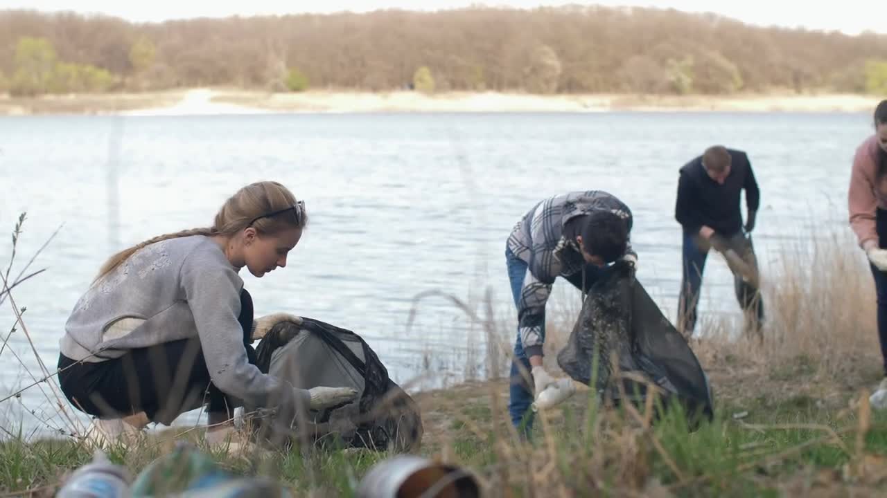 Free Stock Video Volunteers Cleaning Up Trash Next To A River Live Wallpaper