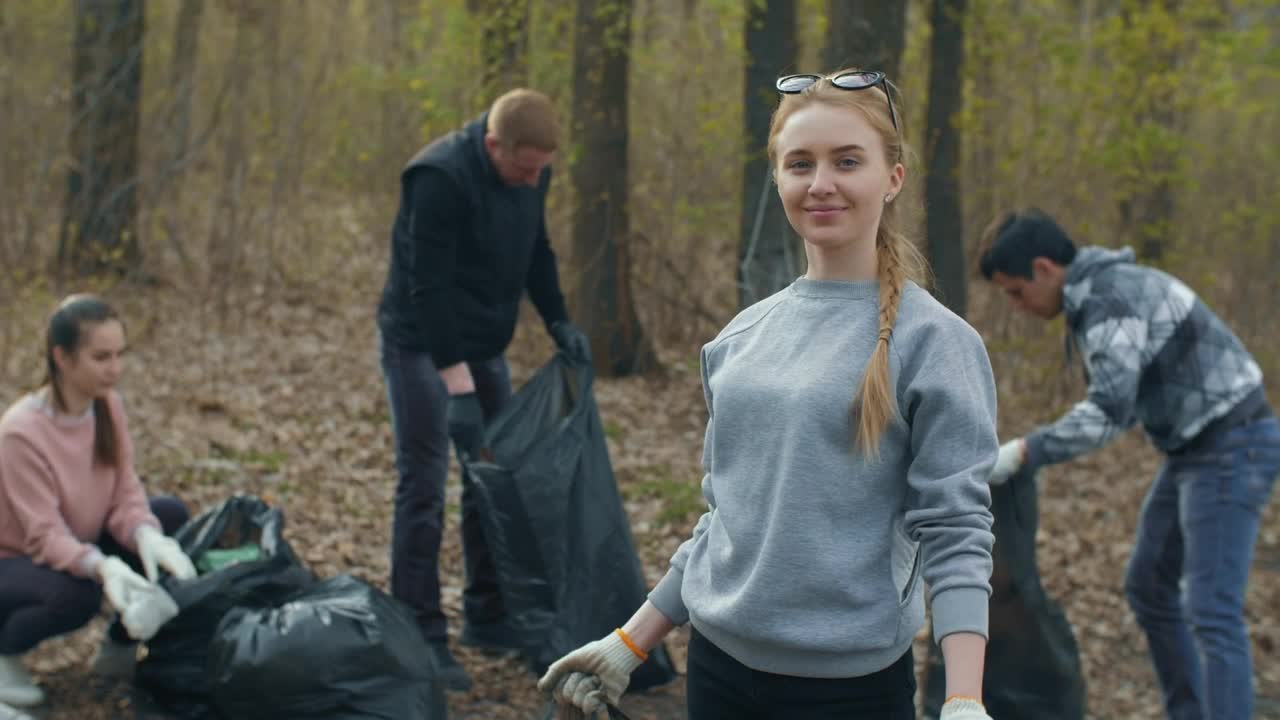 Free Stock Video Volunteer Showing The Trash She Recycles Live Wallpaper