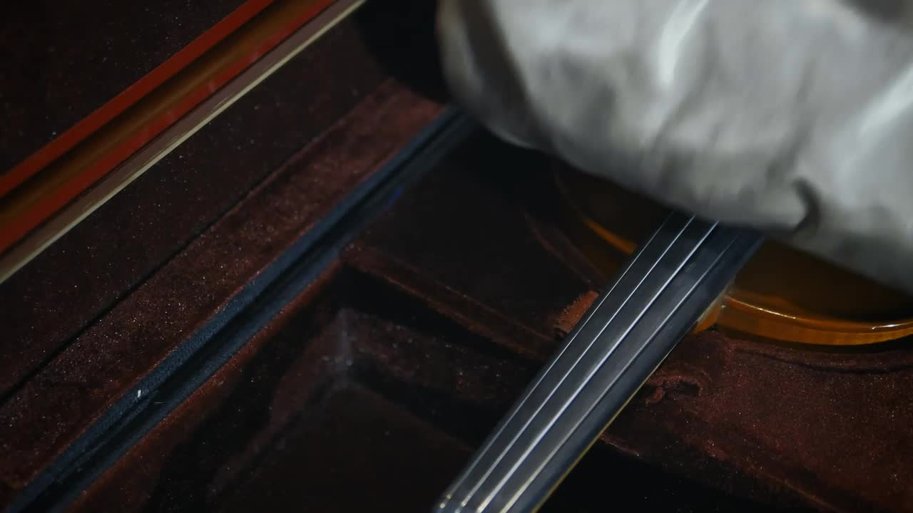 Free Stock Video Violinist Carefully Removing His Violin From Its Case Live Wallpaper