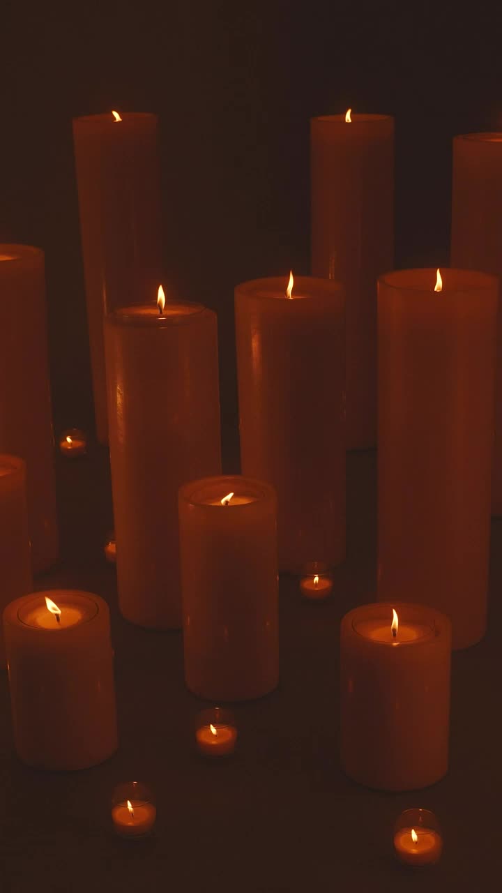 Free Stock Video Very Large And Very Small Candles Lit In The Dark Live Wallpaper