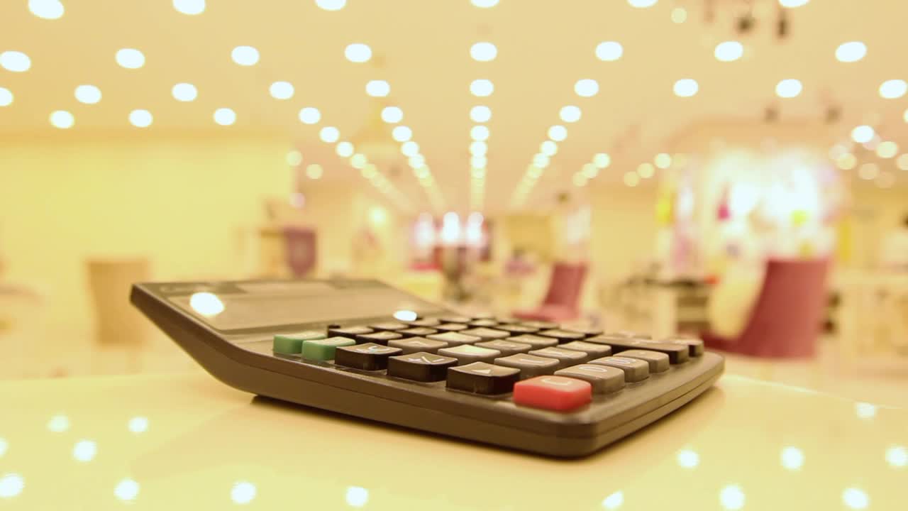 Free Stock Video Typing In A Calculator In A Department Store Live Wallpaper