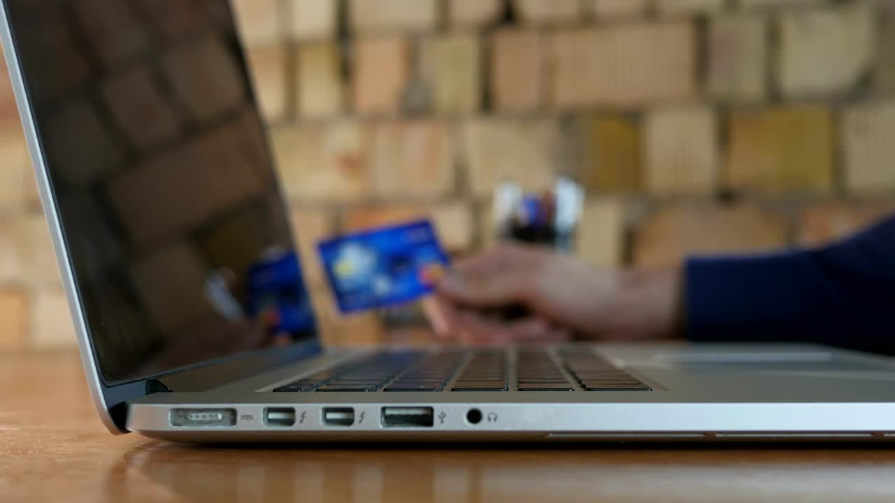 Free Stock Video Typing Bank Details On A Laptop Live Wallpaper