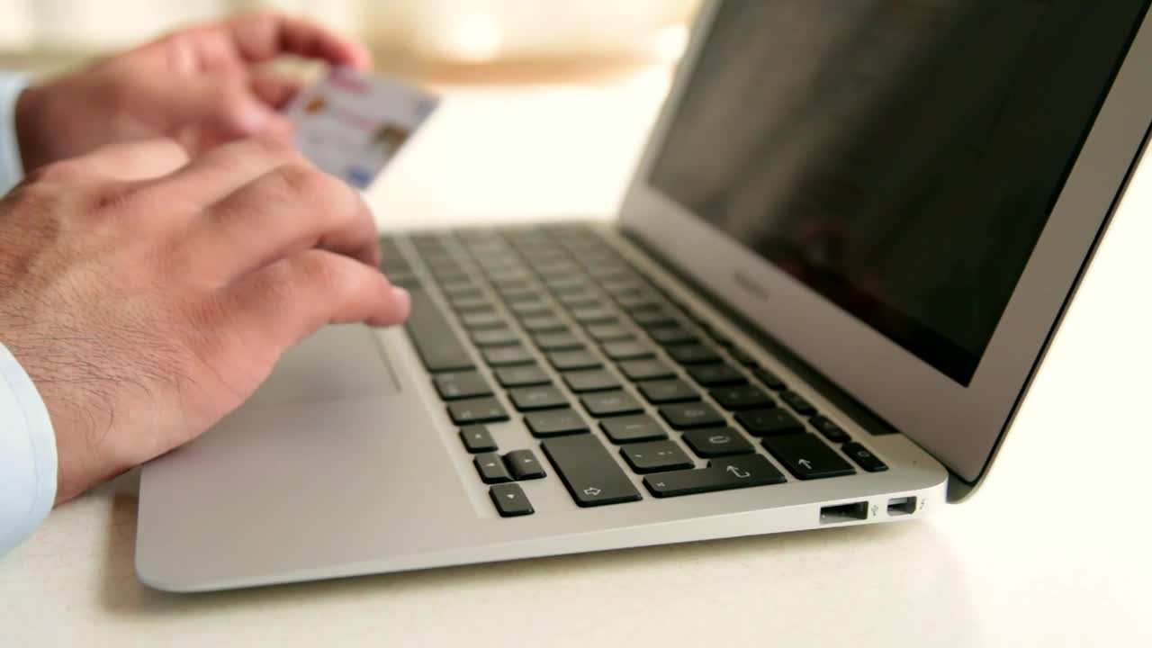Free Stock Video Typing A Credit Card Data Into A Computer Live Wallpaper