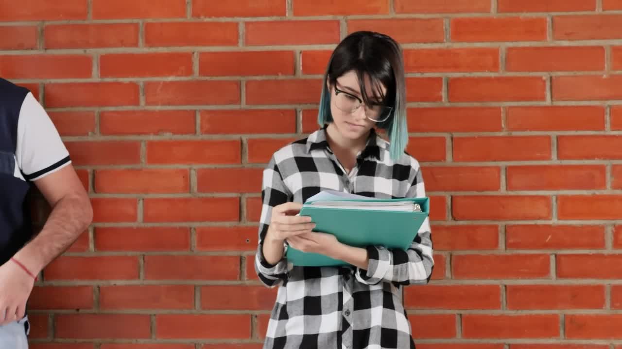 Free Stock Video Two Young People Studying Standing Leaning Against A Wall In Live Wallpaper