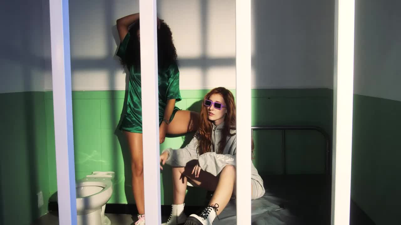 Free Stock Video Two Stylish Friends Incarcerated After A Night Out Live Wallpaper