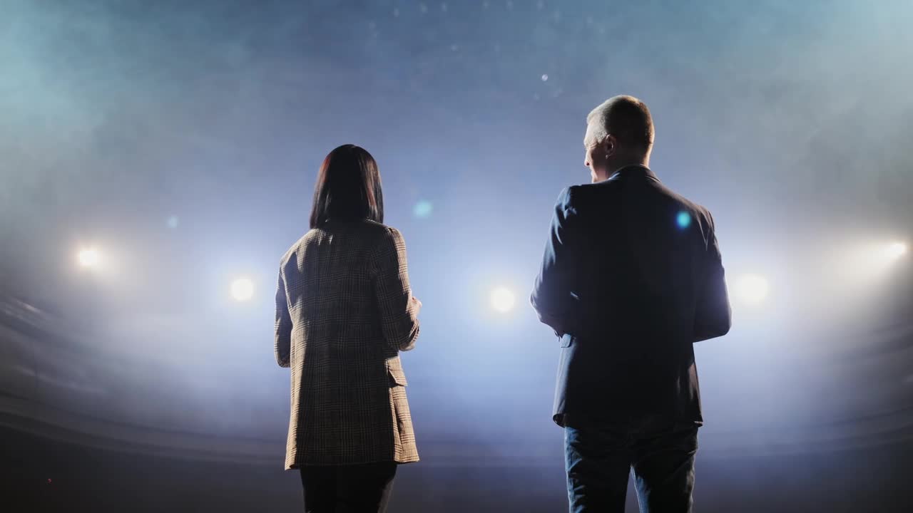 Free Stock Video Two Presenters Speaking Towards The Audience Live Wallpaper