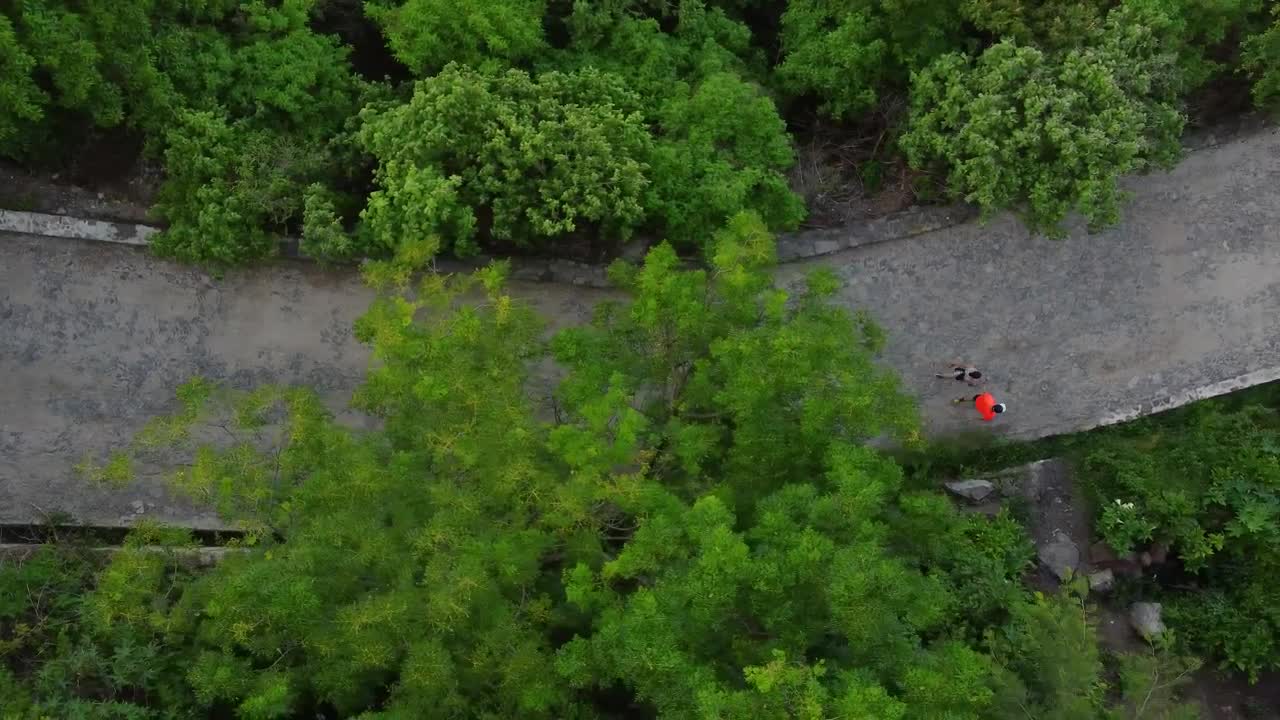 Free Stock Video Two People Walking Down A Road Seen From Above Live Wallpaper