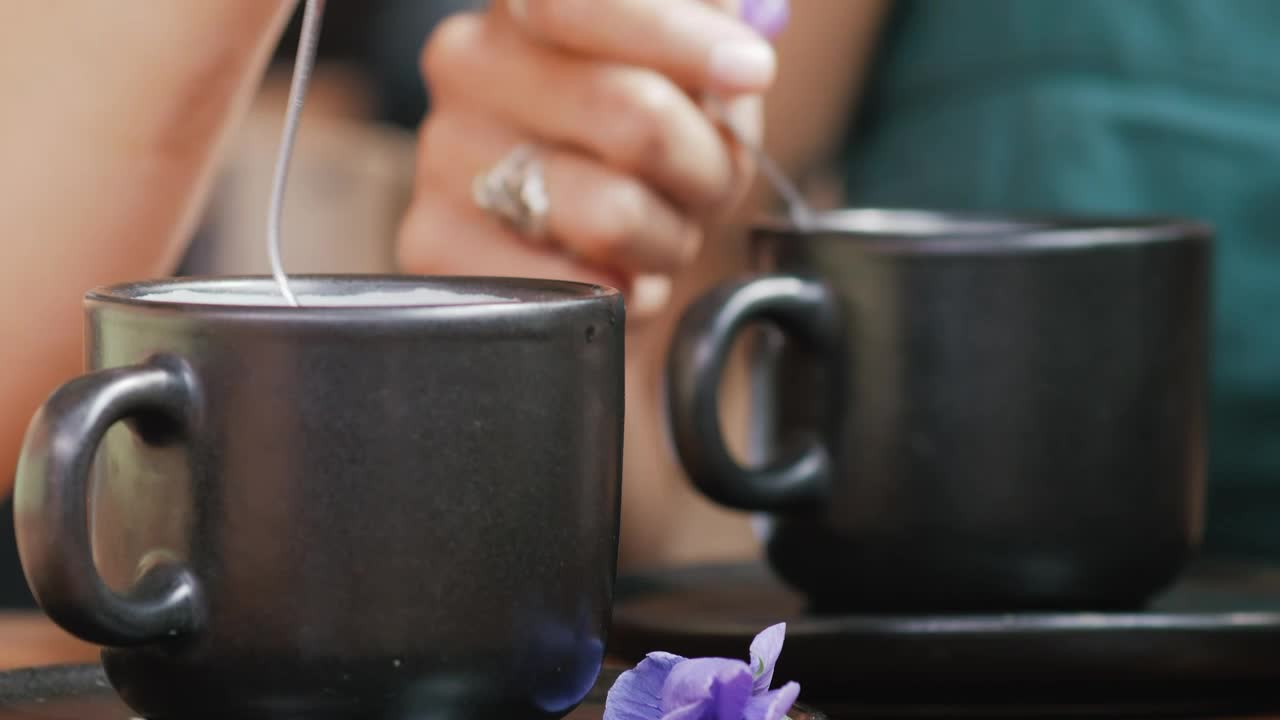 Free Stock Video Two People Moving Coffee In Cup With A Spoon Live Wallpaper
