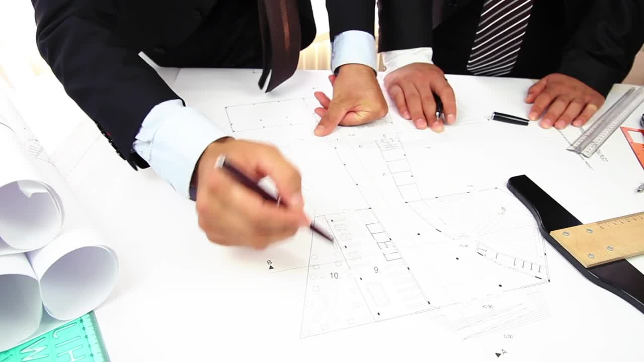 Free Stock Video Two People Discussing An Architectural Blueprint Live Wallpaper