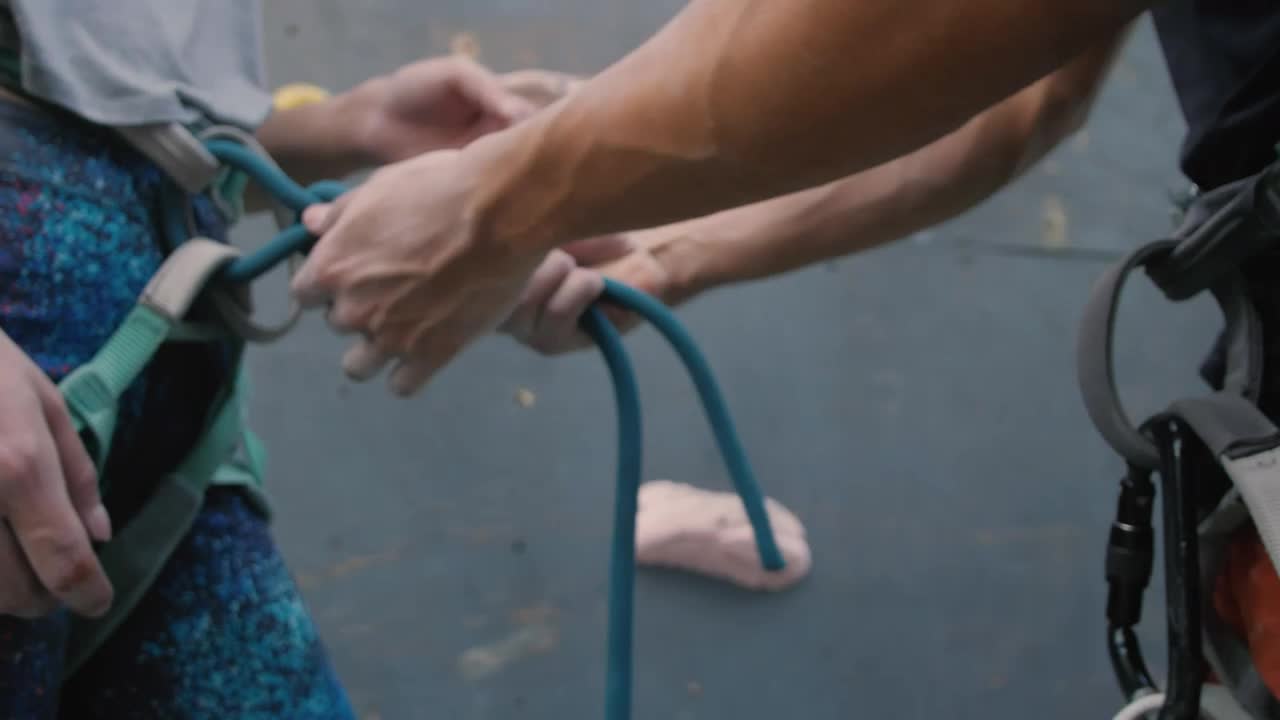 Free Stock Video Two People Adjusting Harnesses On Their Body Live Wallpaper