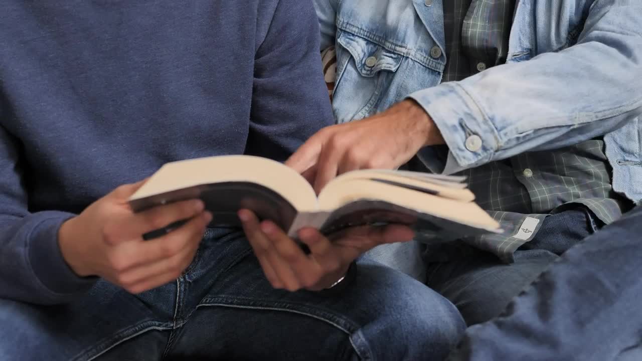 Free Stock Video Two Men Reading A Book Together Live Wallpaper