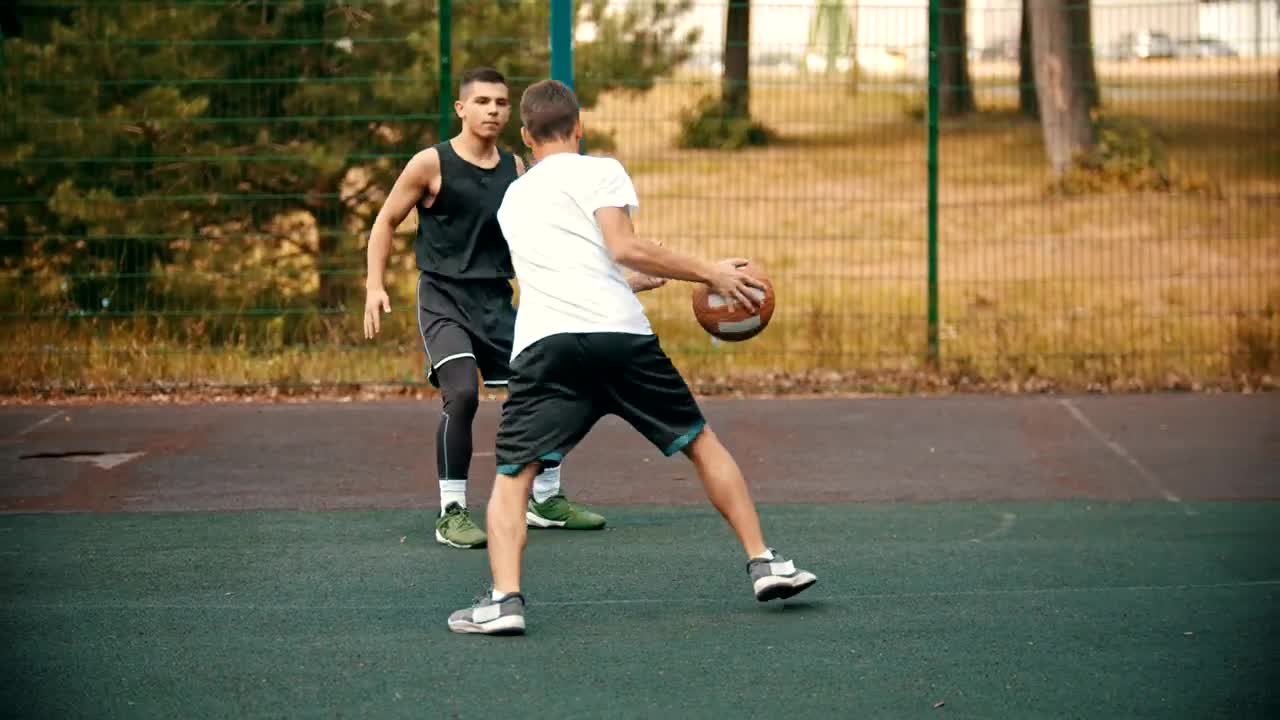 Free Stock Video Two Men Playing Basketball In A Park Live Wallpaper