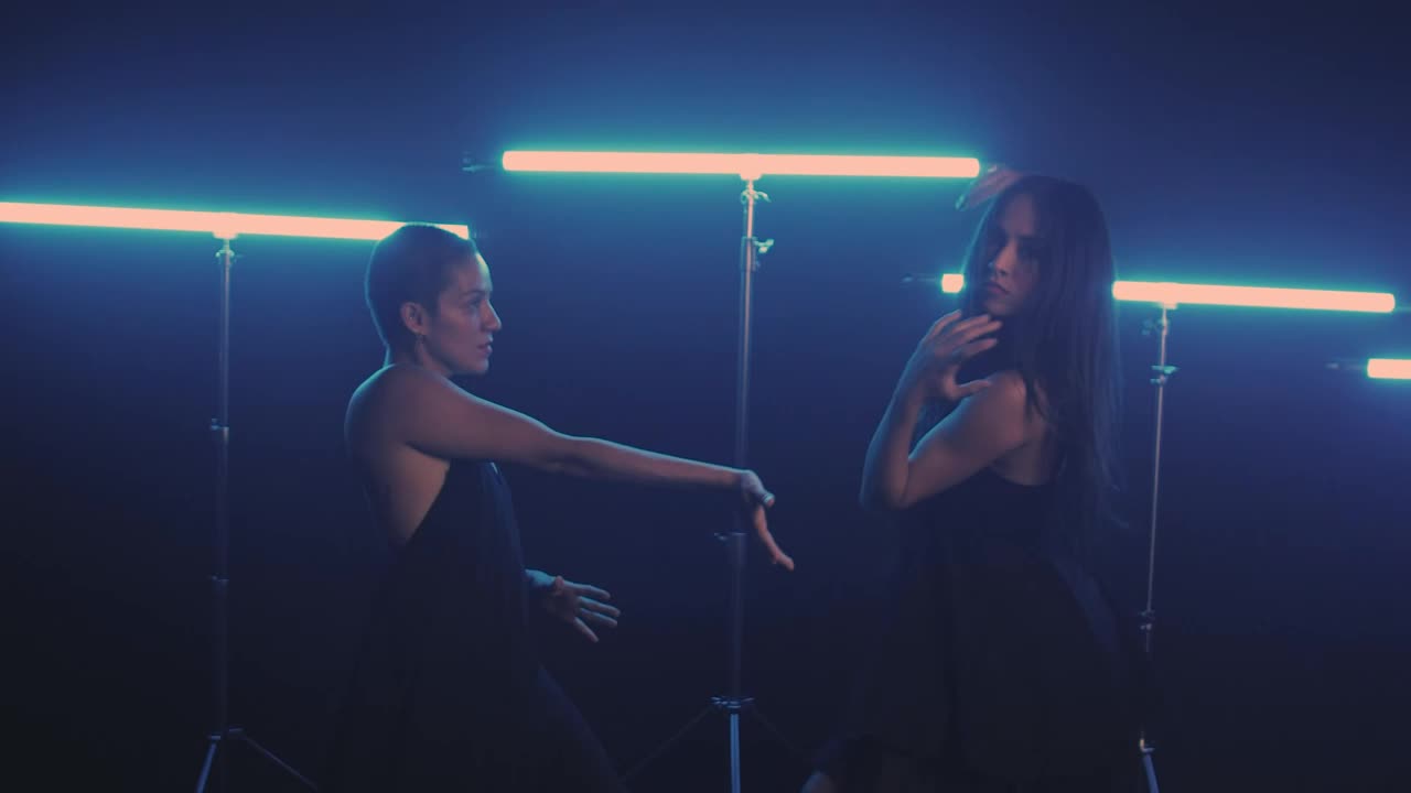 Free Stock Video Two Girls Dancing With Blue Neon Lights In The Background Live Wallpaper