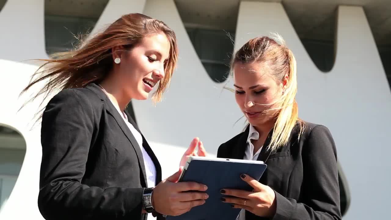 Free Stock Video Two Business Women Commenting On Something On A Tablet Live Wallpaper