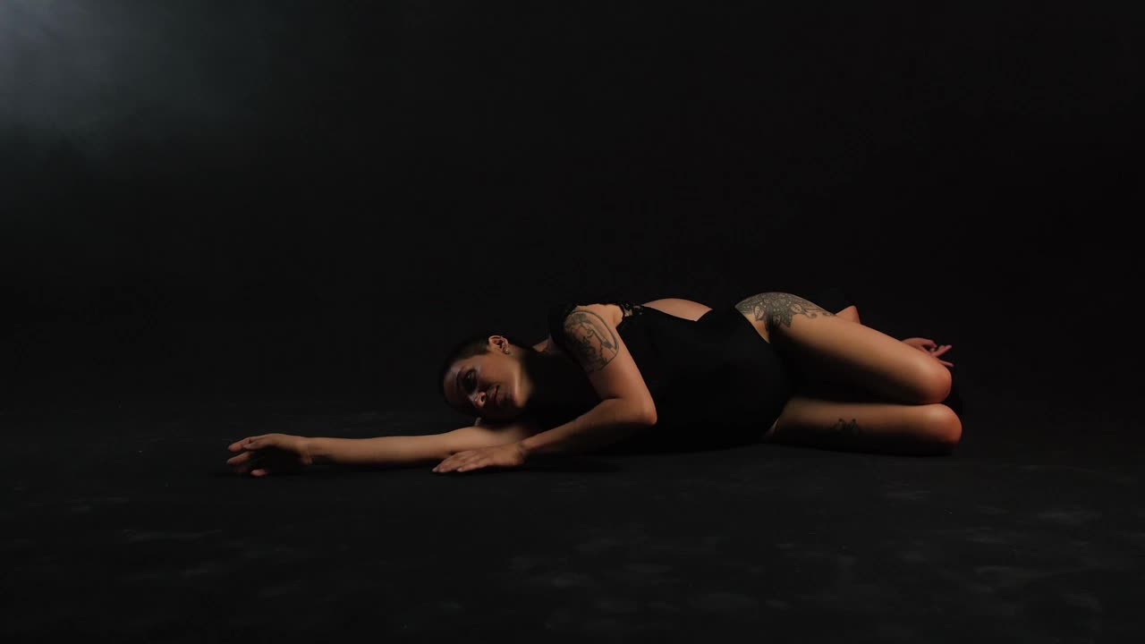 Free Stock Video Two Ballerinas Lying On The Floor On A Black Background Live Wallpaper