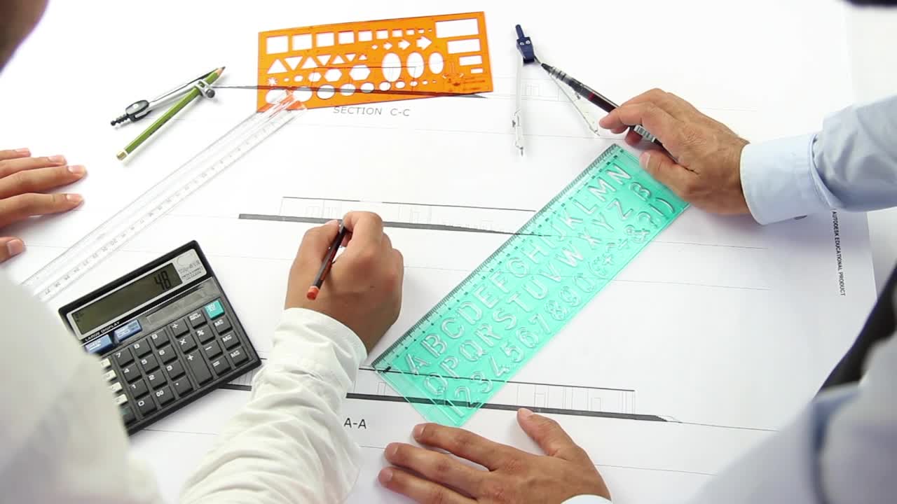 Free Stock Video Two Architects Working On An Architectural Plan Live Wallpaper