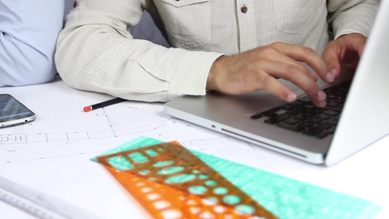 Free Stock Video Two Architects Working On A Drawing Board Live Wallpaper