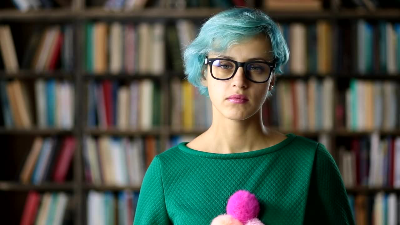 Free Stock Video Young Woman With Glasses In A Library Portrait Live Wallpaper