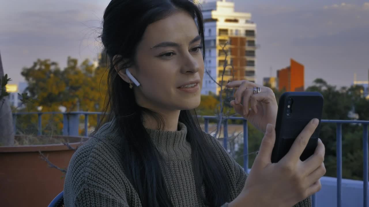Free Stock Video Young Woman On A Terrace Having A Video Call Live Wallpaper