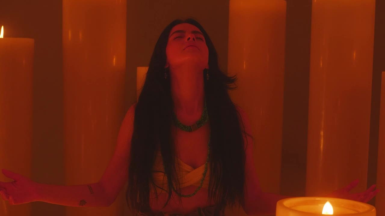Free Stock Video Young Woman Meditating Among Many Huge Candles Live Wallpaper