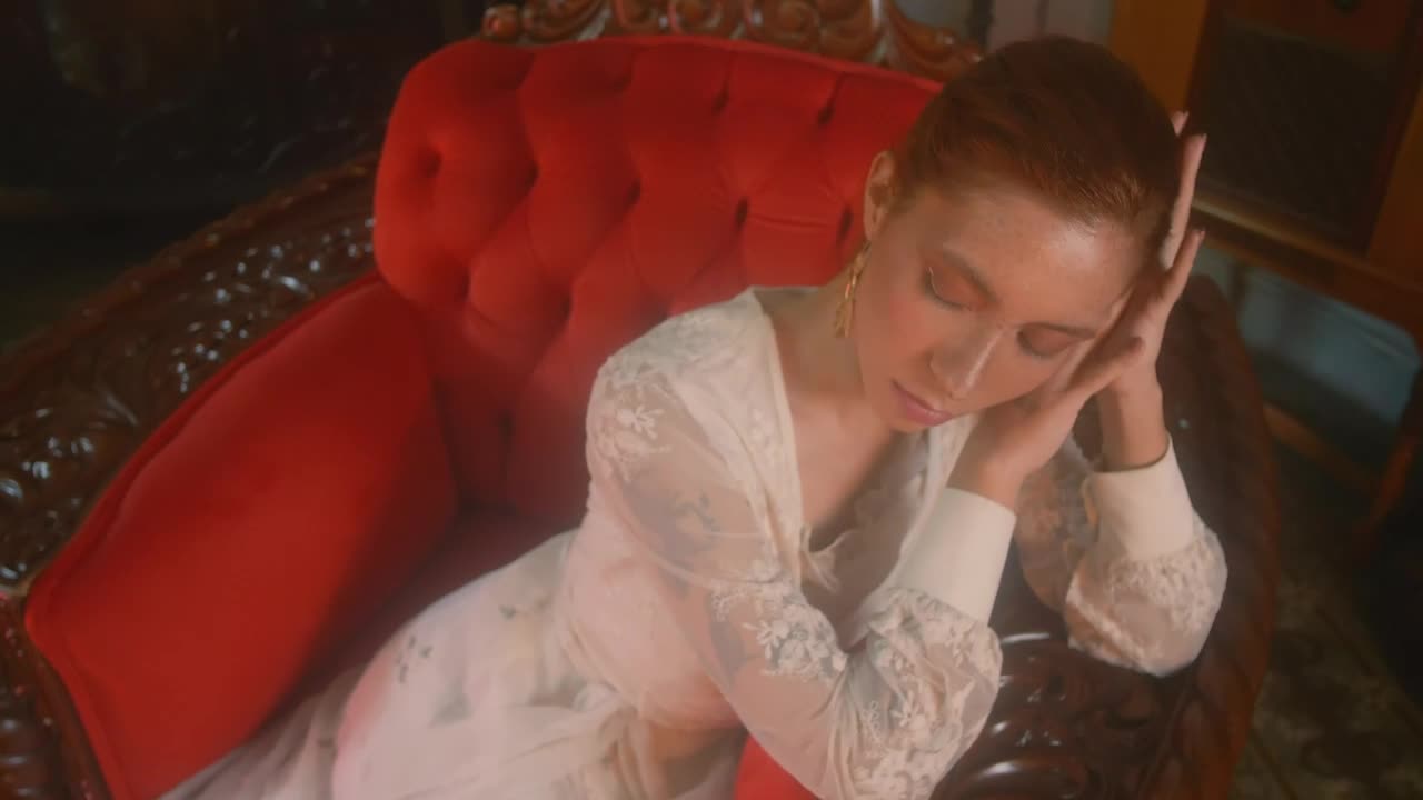 Free Stock Video Young Woman From An Old Era Sitting On A Sofa Live Wallpaper