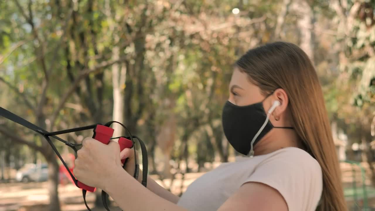 Free Stock Video Young Woman Exercising At Park Using Face Mask Live Wallpaper