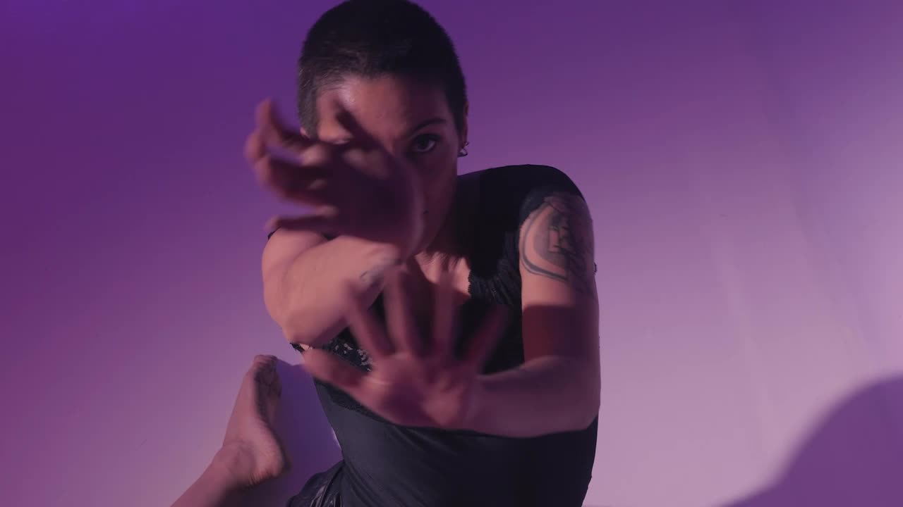 Free Stock Video Young Woman Dancing Sitting On The Floor On Lilac Background Live Wallpaper