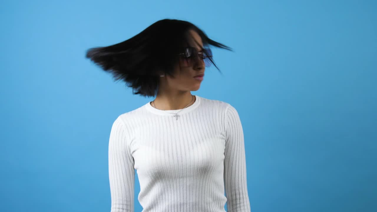 Free Stock Video Young Woman Dancing On A Blue Background Live Wallpaper