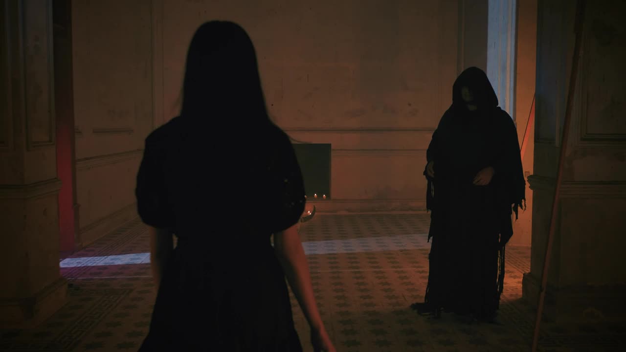 Free Stock Video Young Woman And Hooded Man Around An Altar With Candles Live Wallpaper