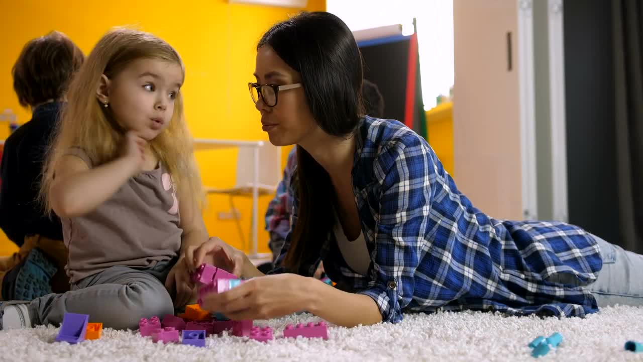 Free Stock Video Young Teacher Playing With Legos With Her Students Live Wallpaper