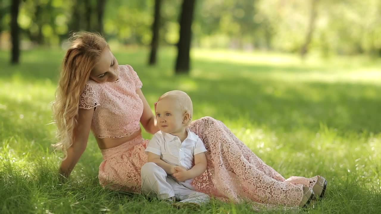 Free Stock Video Young Mother Caresses Her Son In The Park Live Wallpaper