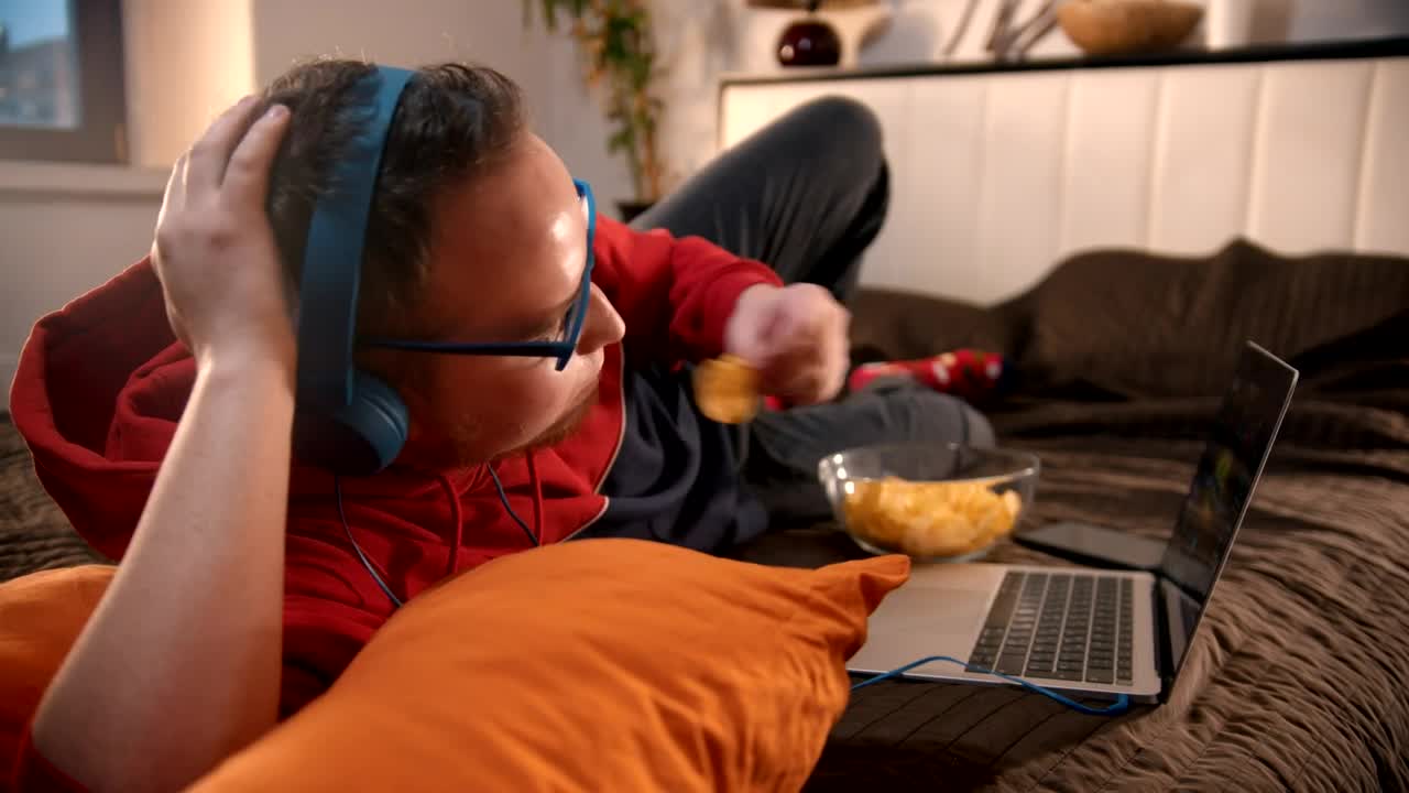 Free Stock Video Young Man Watching Videos And Eating Snacks Live Wallpaper