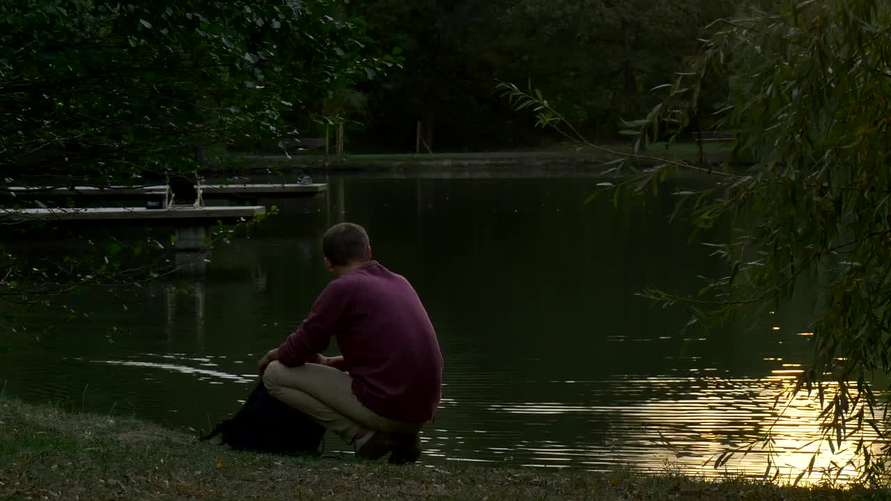 Free Stock Video Young Man Walks Away From A Lake After Appreciating It Live Wallpaper