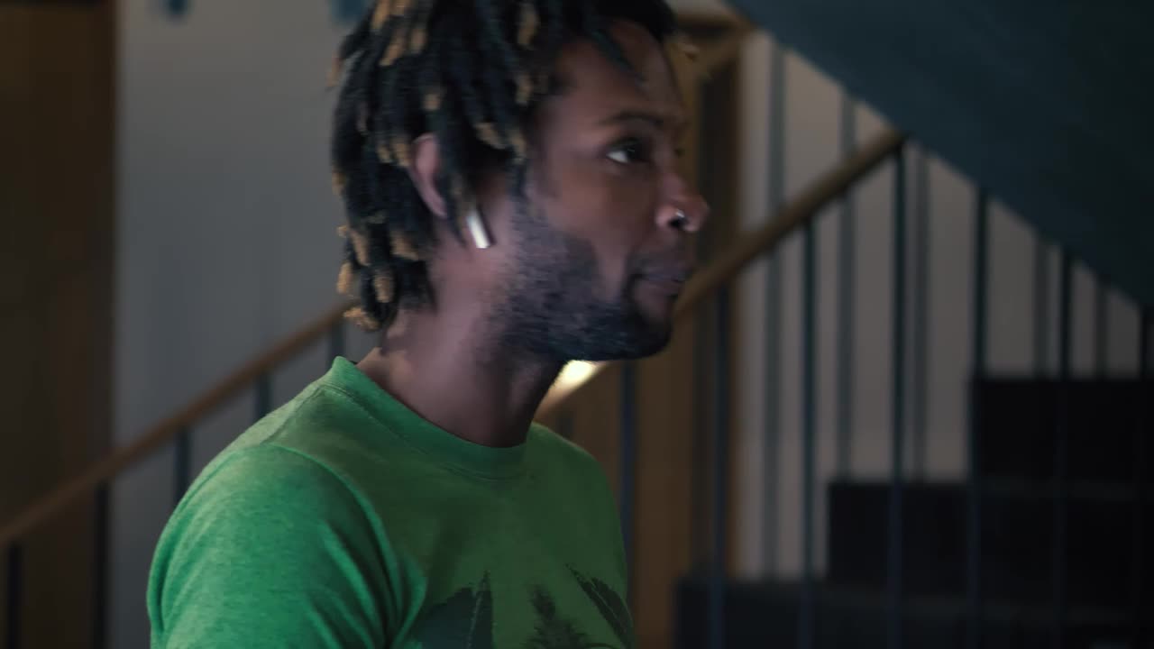 Free Stock Video Young Man Talking On The Phone With Bluetooth Earphones Live Wallpaper