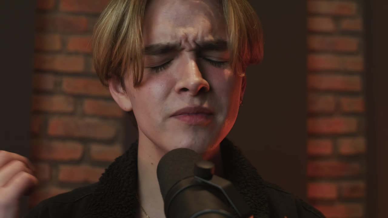 Free Stock Video Young Man Singing Into A Microphone Live Wallpaper