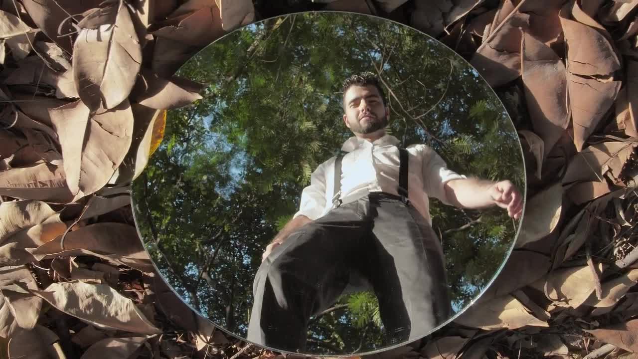 Free Stock Video Young Man Picking Up A Mirror In A Forest Live Wallpaper