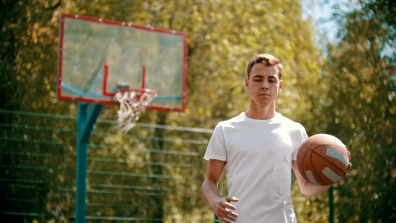 Free Stock Video Young Man Dribbling A Basketball Facing The Lens Live Wallpaper