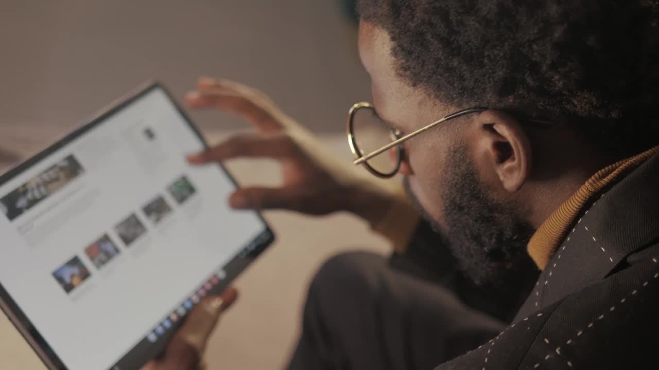 Free Stock Video Young Man Browsing The Internet With A Tablet Live Wallpaper