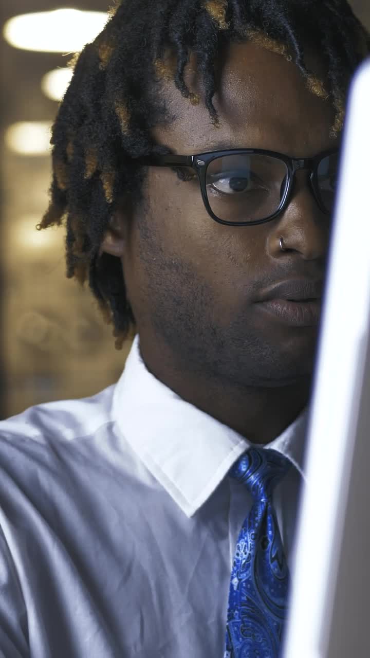 Free Stock Video Young Man Adjusting His Glasses While Working On Computer Live Wallpaper