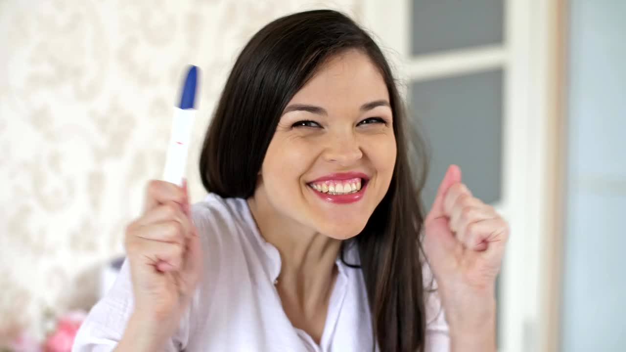 Free Stock Video Young Happy And Excited Woman With A Pregnancy Test Live Wallpaper