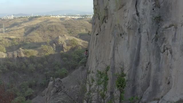 Free Stock Video Young Female Mountaineer Climbing A Large Rocky Mountain Smalllive Wallpaper