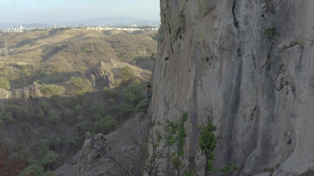 Free Stock Video Young Female Mountaineer Climbing A Large Rocky Mountain Live Wallpaper