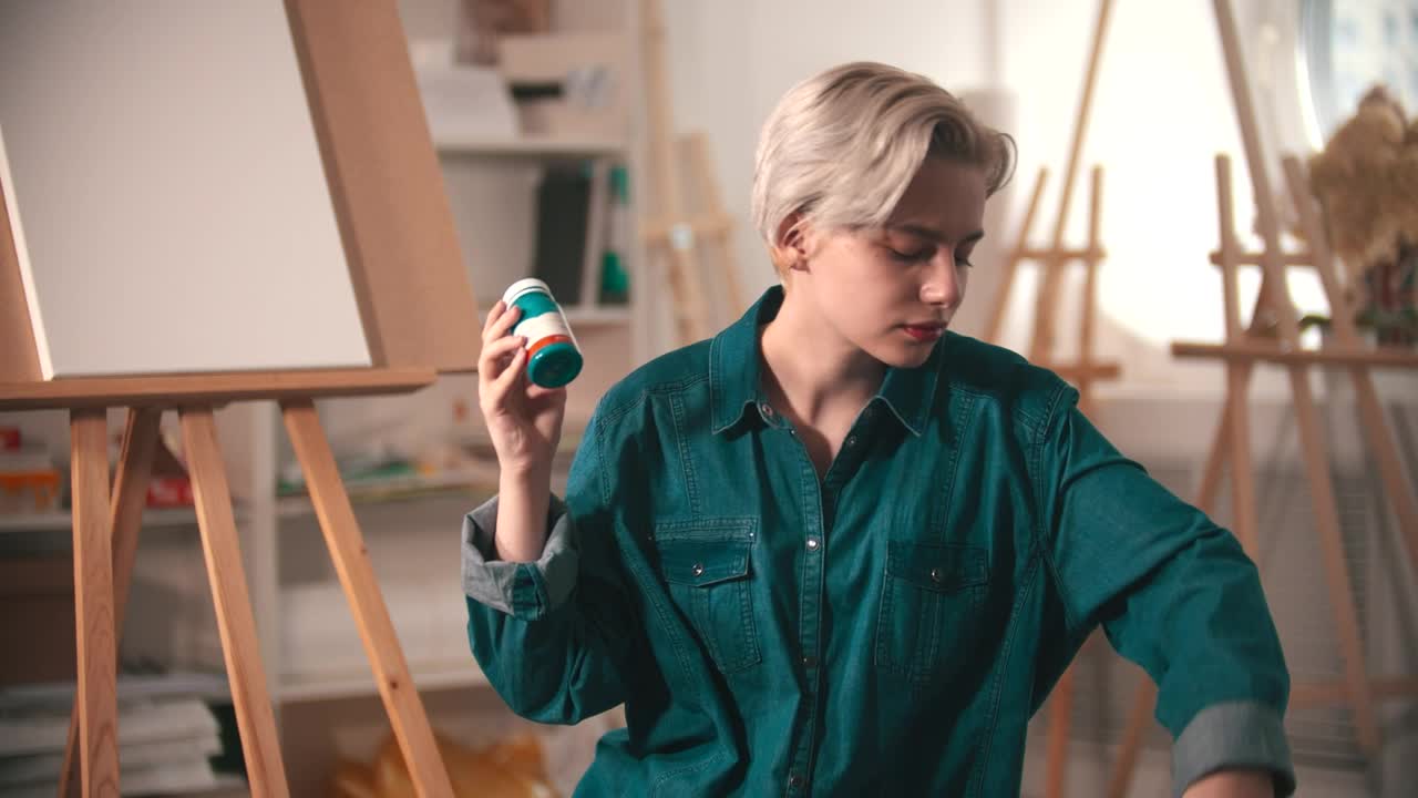 Free Stock Video Young Female Artist Selecting Tubes Of Paint Live Wallpaper