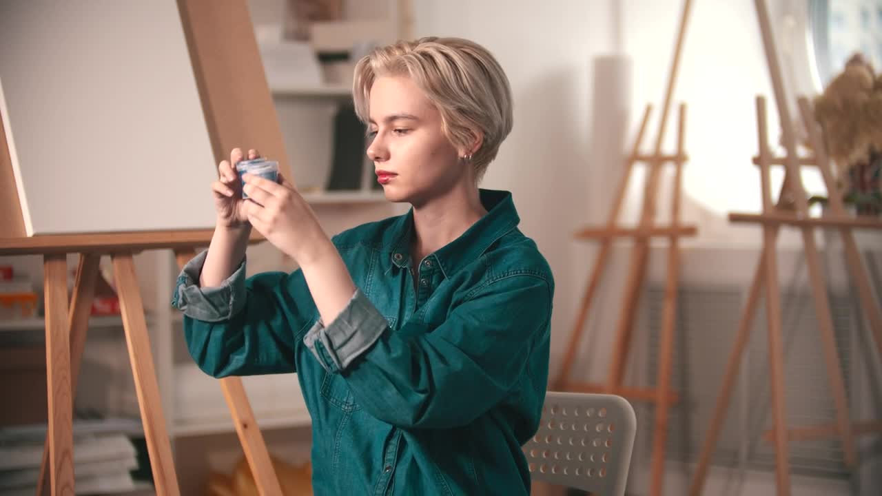 Free Stock Video Young Artist Choosing Blue Paint At Her Workshop Live Wallpaper