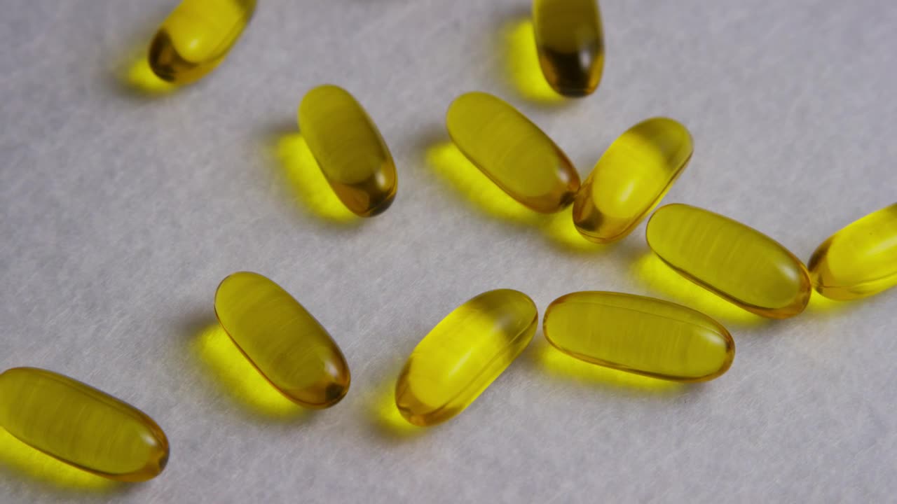 Free Stock Video Yellow Colored Pills Over A Wide Fabric Live Wallpaper