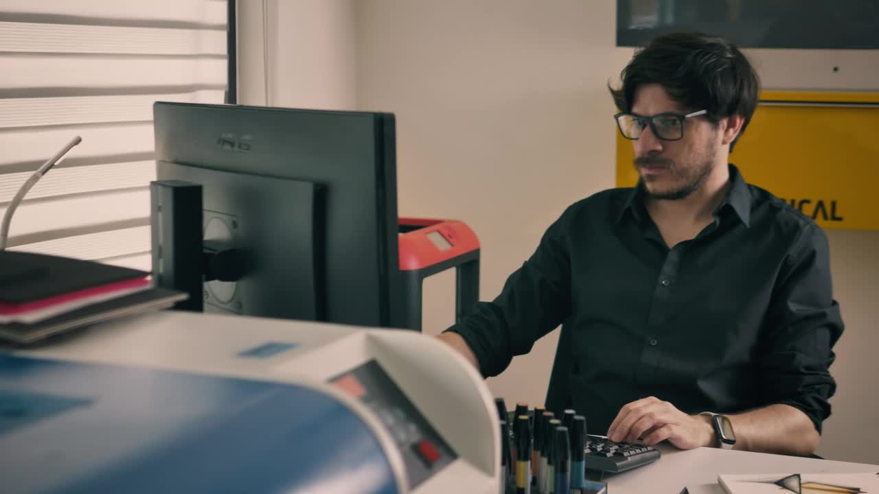 Free Stock Video Working On The Computer In A Studio With Printers Live Wallpaper
