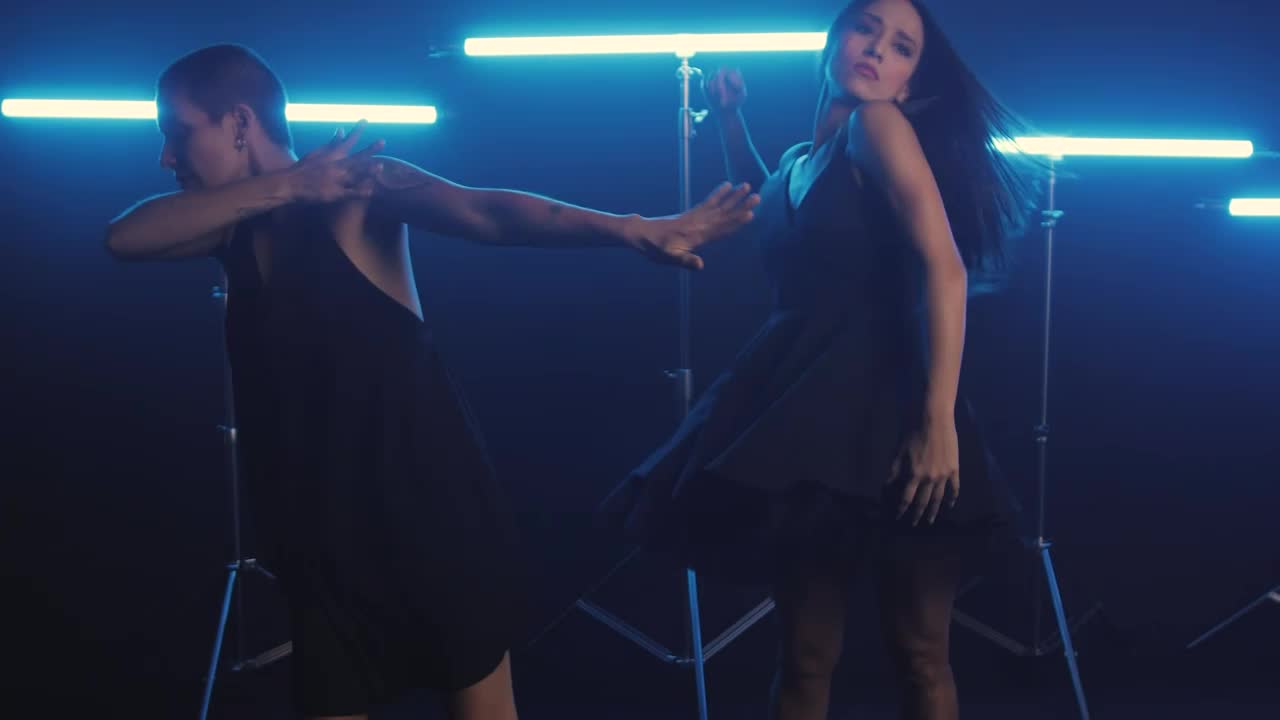 Free Stock Video Women Dancing Energetically With Neon Blue Lights Live Wallpaper