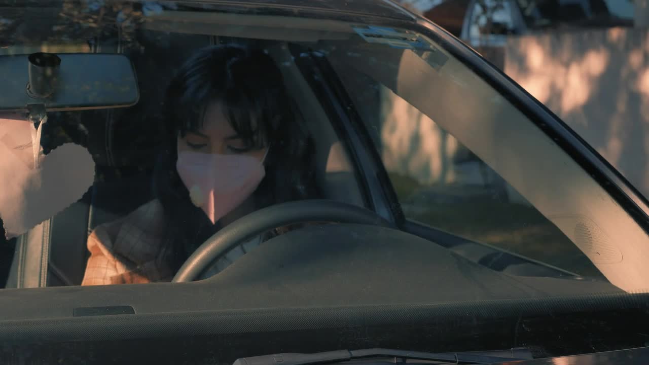 Free Stock Video Woman Wearing A Face Mask Parking Her Car Live Wallpaper
