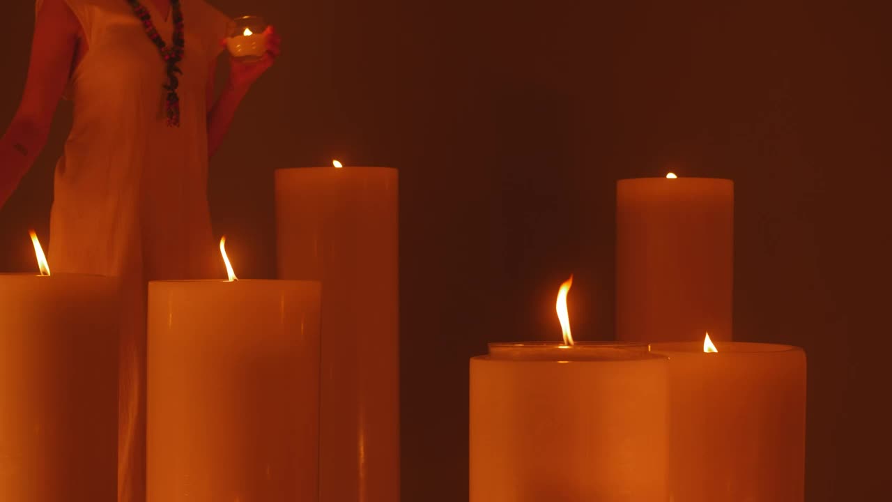 Free Stock Video Woman Walking Among Huge Candles Live Wallpaper