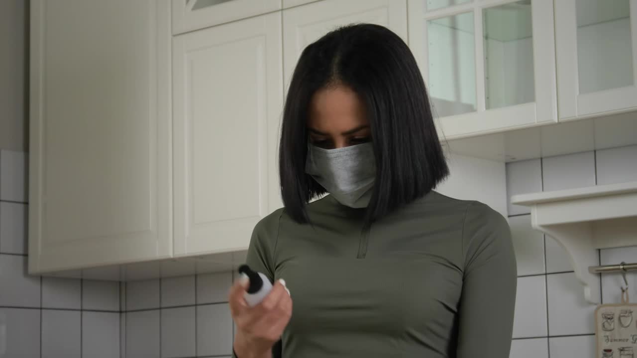 Free Stock Video Woman Using The Hand Sanitizer In The Kitchen Live Wallpaper